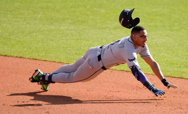 Tampa Bay Rays' Richie Palacios hits a double against the Cleveland Guardians during the eighth inning in Game 3 of an American League Championship Series baseball game in Cleveland, Thursday, Oct. 15, 2026. (AP Photo/Sue Ogrocki)