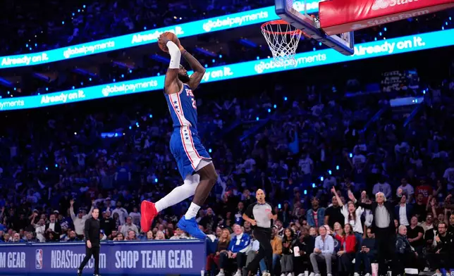 Philadelphia 76ers' LeBron James goes up for a dunk during the first half of an NBA basketball game against the Cleveland Cavaliers Thursday, Oct. 22, 2026, in Philadelphia. (AP Photo/Matt Slocum)