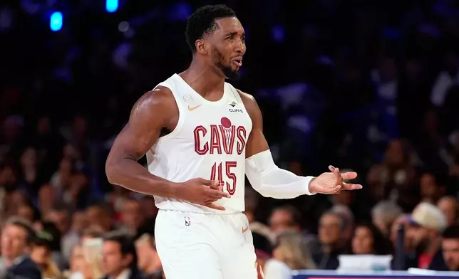 Cleveland Cavaliers' Donovan Mitchell celebrates after scoring during the first half of an NBA basketball game against the Philadelphia 76ers Thursday, Oct. 22, 2026, in Philadelphia. (AP Photo/Matt Slocum)