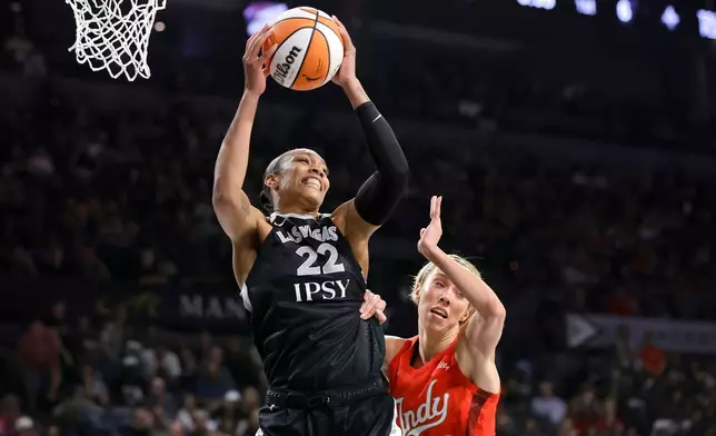 Las Vegas Aces center A'ja Wilson (22) pulls down a rebound by Indiana Fever guard Lexie Hull (10) during the first half in Game 3 of an WNBA basketball first-round playoff series Thursday, Oct.1, 2026, in Las Vegas. (AP Photo/Steve Marcus)