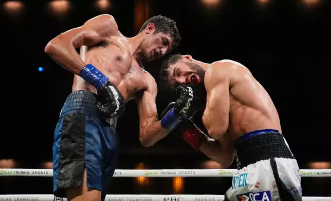 Sebastian Fundora, left, fights Ermal Hadribeaj during a super welterweight championship boxing match Saturday, Oct. 17, 2026, in Las Vegas. (AP Photo/John Locher)