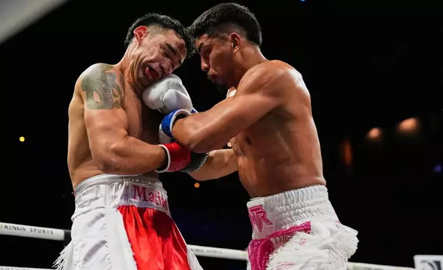 Marco Romero, right, fights Matias Ferreira during a super middleweight boxing match Saturday, Oct. 17, 2026, in Las Vegas. (AP Photo/John Locher)
