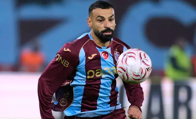 Trabzonspor's Mohamed Salah runs for the ball during a Turkish Super Lig soccer match between Trabzonspor and Besiktas in Trabzon, Turkey, Monday, Oct. 19, 2026. (AP Photo/Khalil Hamra)
