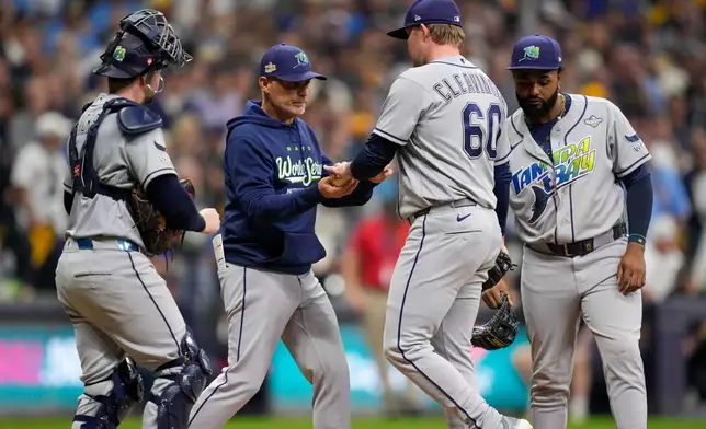 Tampa Bay Rays manager Kevin Cash pulls Tampa Bay Rays pitcher Garrett Cleavinger from the game during the eighth inning of Game 1 of baseball's World Series, Friday, Oct. 23, 2026, in Milwaukee, between the Milwaukee Brewers and the Tampa Bay Rays. (AP Photo/Ashley Landis)