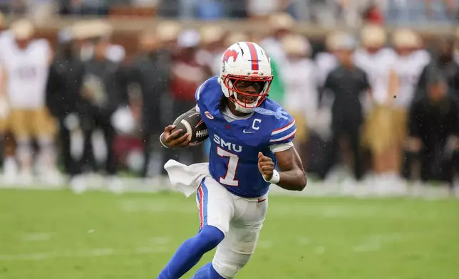 SMU quarterback Kevin Jennings rushes for a touchdown during an NCAA college football game against Boston College, Saturday, Oct. 3, 2026, in Dallas. (AP Photo/Gareth Patterson)