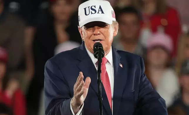 President Donald Trump speaks at a campaign rally at Pitt–Greenville Airport, Tuesday, Oct. 20, 2026, in Greenville, N.C. (AP Photo/Matt Ramey)