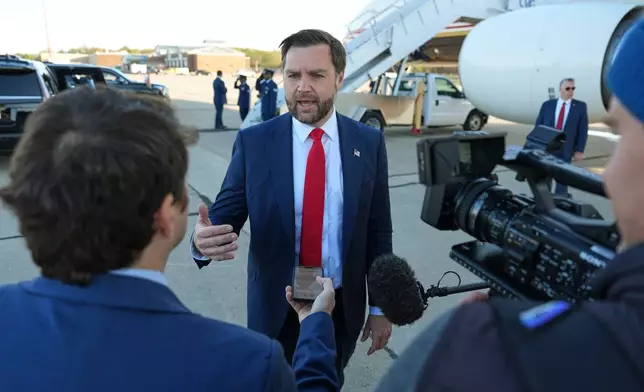 Vice President JD Vance speaks to reporters before boarding Air Force Two, at Cincinnati/Northern Kentucky International Airport, in Hebron, Ky., Thursday, Oct. 22, 2026, en route to a campaign rally in Nebraska. (AP Photo/Jacquelyn Martin, Pool)