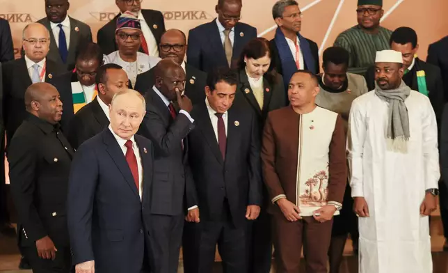 Russian President Vladimir Putin, foreground left, and other leaders pose for a family photo during the Russia-Africa Summit in Moscow, Thursday, Oct. 29, 2026. (Anastasia Barashkova/Pool Photo via AP)