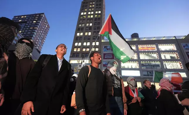 Protesters gather near a vigil marking the third anniversary of the October 7 attacks on Israel Wednesday, Oct. 7, 2026, in New York. (AP Photo/Frank Franklin II)