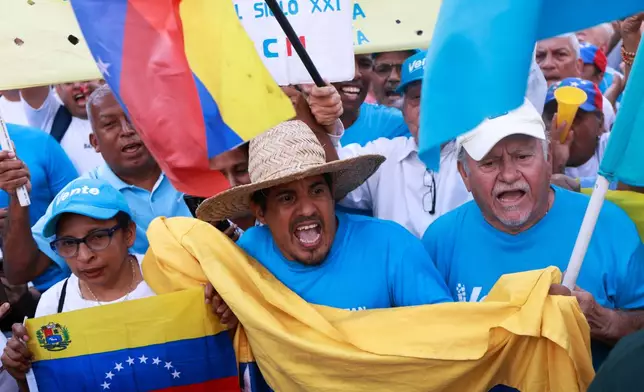 Supporters of Venezuelan opposition leader Maria Corina Machado cheer as they wait for her to arrive in Caracas, Venezuela, Sunday, Oct. 25, 2026. (AP Photo/Javier Campos)