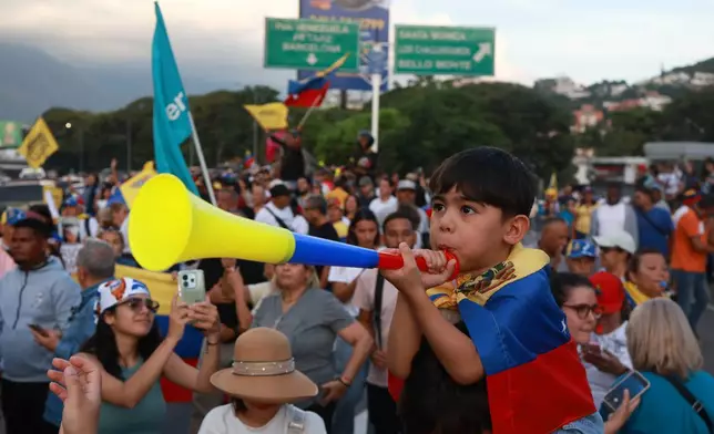 Supporters of Venezuelan opposition leader and Nobel Peace Prize laureate Maria Corina Machado celebrate her return to the country after months abroad in Caracas, Venezuela, Sunday, Oct. 25, 2026 (AP Photo/Javier Campos)