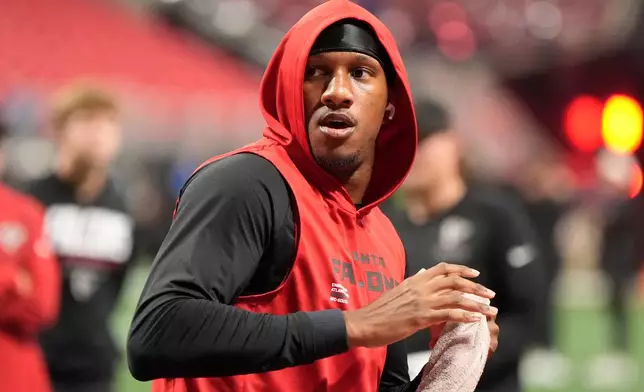 Atlanta Falcons quarterback Michael Penix Jr. warms up before an NFL football game against the Baltimore Ravens, Sunday, Oct. 11, 2026, in Atlanta. (AP Photo/Mike Stewart)