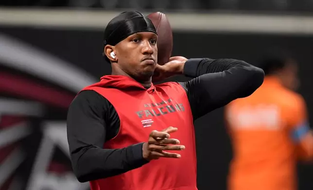 Atlanta Falcons quarterback Michael Penix Jr. warms up before an NFL football game against the Baltimore Ravens, Sunday, Oct. 11, 2026, in Atlanta. (AP Photo/Mike Stewart)