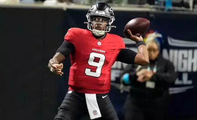 Atlanta Falcons quarterback Michael Penix Jr. throws a pass during the first half of an NFL football game against the Baltimore Ravens, Sunday, Oct. 11, 2026, in Atlanta. (AP Photo/Mike Stewart)