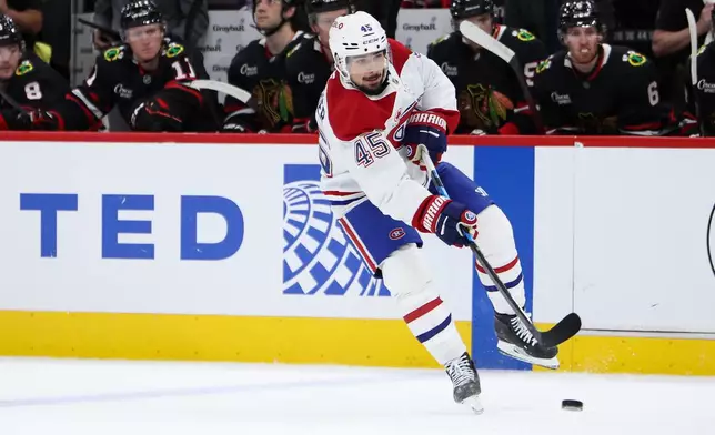 Montreal Canadiens defenseman Alexandre Carrier shoots during the first period of an NHL hockey game against the Chicago Blackhawks, Friday, Oct. 23, 2026, in Chicago. (AP Photo/Jessie Alcheh)