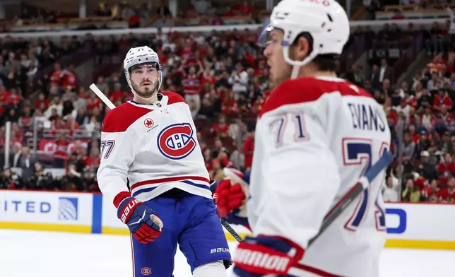 Montreal Canadiens center Kirby Dach, left, celebrates with center Jake Evans (71) after Evans scored during the first period of an NHL hockey game against the Chicago Blackhawks, Friday, Oct. 23, 2026, in Chicago. (AP Photo/Jessie Alcheh)