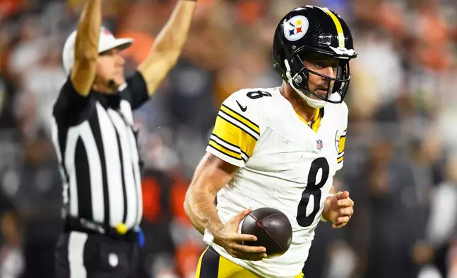 Pittsburgh Steelers quarterback Aaron Rodgers celebrates after scoring against the Cleveland Browns during the second half of an NFL football game in Cleveland, Thursday, Oct. 1, 2026. (AP Photo/David Richard)