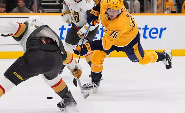 Nashville Predators defenseman Brady Skjei (76) shoots the puck past Vegas Golden Knights left wing Trevor Connelly (24) during the second period of an NHL hockey game Tuesday, Oct. 13, 2026, in Nashville, Tenn. (AP Photo/George Walker IV)