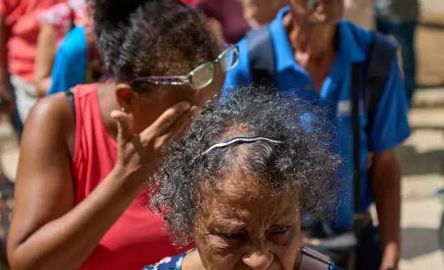 People line up to receive free medication distributed by the “Medicine Is Not for Sale” community project. in Havana, Cuba, Thursday, Oct. 8, 2026. (AP Photo/Ramon Espinosa)
