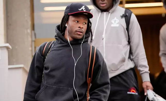 New Orleans Saints' Alvin Kamara arrives at the reception pavilion of Charles de Gaulle airport in Roissy north of Paris, Monday, Oct. 19, 2026. (AP Photo/Teresa Suarez)