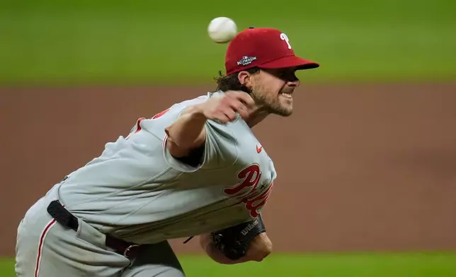 Philadelphia Phillies pitcher Aaron Nola throws against the Atlanta Braves in the first inning during Game 3 of baseball's NL Wild Card Series, Thursday, Oct. 1, 2026, in Atlanta. (AP Photo/Mike Stewart)