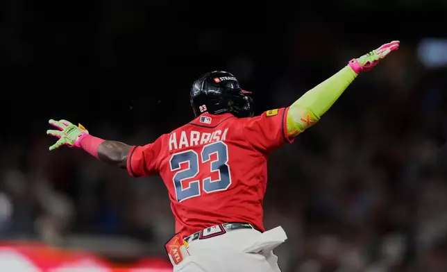 Atlanta Braves' Michael Harris II celebrates his three-run home run against the Philadelphia Phillies in the first inning during Game 3 of baseball's NL Wild Card Series, Thursday, Oct. 1, 2026, in Atlanta. (AP Photo/Brynn Anderson)