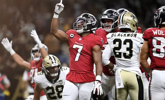 Atlanta Falcons running back Bijan Robinson (7) celebrates after scoring against the New Orleans Saints during the first half of an NFL football game in New Orleans, Monday, Oct. 5, 2026. (AP Photo/Ella Hall)