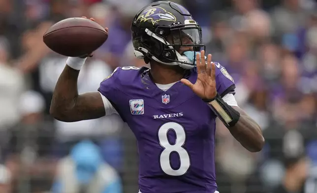 Baltimore Ravens quarterback Lamar Jackson (8) looks to throw a pass during the first half of an NFL football game in Baltimore, Sunday, Oct. 4, 2026. (AP Photo/Stephanie Scarbrough)
