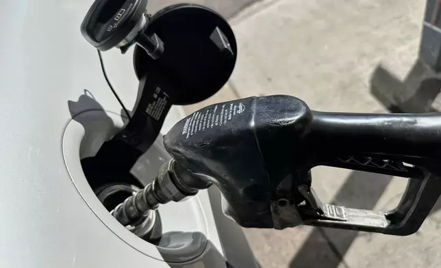A motorist fills the tank of a vehicle at a Shell gasoline station Thursday, Oct. 8, 2026, in Englewood, Colo. (AP Photo/David Zalubowski)