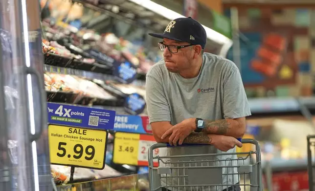 A shopper looks the meat section of a grocery story in Fort Worth, Texas, Wednesday, Oct. 7, 2026. (AP Photo/LM Otero)