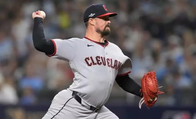 Cleveland Guardians pitcher Shawn Armstrong throws against the Tampa Bay Rays during the seventh inning in Game 2 of an American League Championship Series baseball game in St. Petersburg, Fla. Tuesday, Oct. 13, 2026. (AP Photo/Phelan M. Ebenhack)