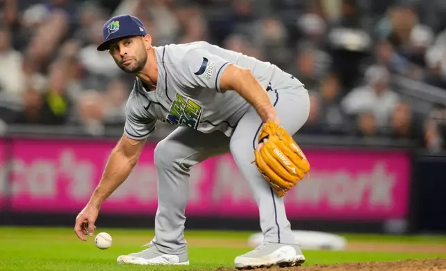 Tampa Bay Rays pitcher Nick Martinez attempts to field a single hit by New York Yankees' Anthony Volpe during the fourth inning in Game 3 of baseball's American League Division Series, Wednesday, Oct. 7, 2026, in New York. (AP Photo/Yuki Iwamura)