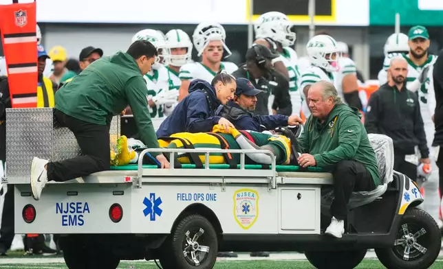 Green Bay Packers wide receiver Jayden Reed (11) is taken off the field following an injury during an NFL football game againt the New York Jets in East Rutherford, N.J., Sunday, Sept. 20, 2026. (AP Photo/Yuki Iwamura)
