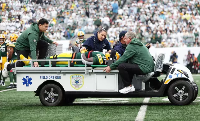 Green Bay Packers wide receiver Jayden Reed (11) is taken off the field following an injury during an NFL football game againt the New York Jets in East Rutherford, N.J., Sunday, Sept. 20, 2026. (AP Photo/Adam Hunger)