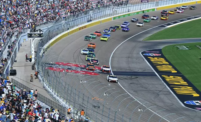 The field passes the start/finish line of Las Vegas Motor Speedway during a NASCAR Cup Series auto race Sunday, Oct. 4, 2026, in Las Vegas. (AP Photo/Sam Morris)