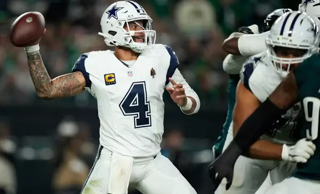 Dallas Cowboys quarterback Dak Prescott looks to pass during the first half of an NFL football game against the Philadelphia Eagles in Philadelphia, Monday, Oct. 26, 2026. (AP Photo/Matt Slocum)