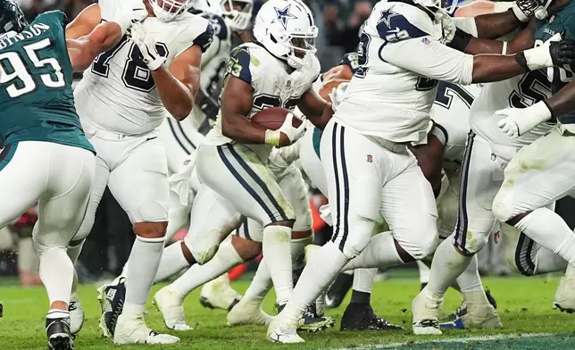 Dallas Cowboys running back Javonte Williams (33) runs for a touchdown during the second half of an NFL football game against the Philadelphia Eagles in Philadelphia, Monday, Oct. 26, 2026. (AP Photo/Matt Rourke)