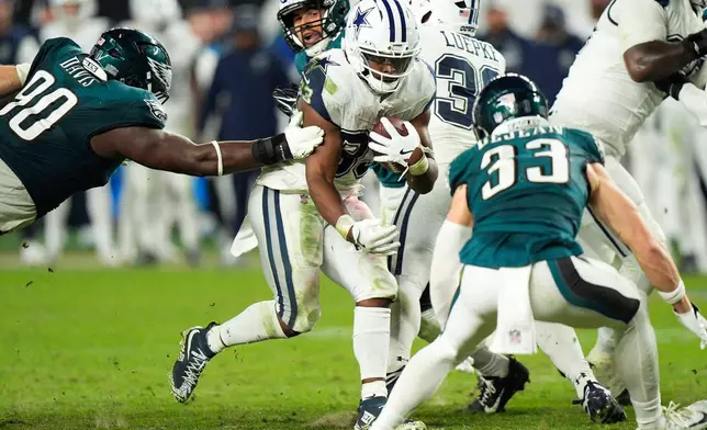 Dallas Cowboys running back Javonte Williams (33) runs for a first down during the second half of an NFL football game against the Philadelphia Eagles in Philadelphia, Monday, Oct. 26, 2026. (AP Photo/Chris Szagola)