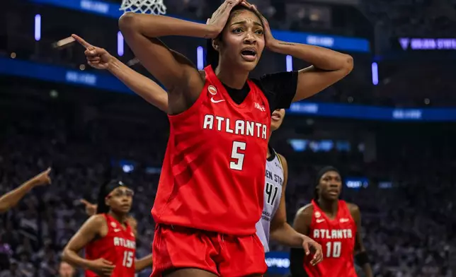 Atlanta Dream forward Angel Reese (5) reacts during the first half of Game 2 of the WNBA basketball finals against the Golden State Valkyries, Monday, Oct. 19, 2026, in San Francisco. (AP Photo/Justine Willard)