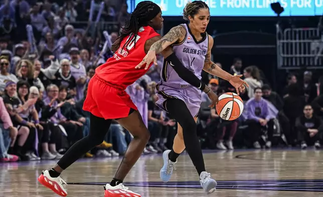 Atlanta Dream guard-forward Rhyne Howard, left, steals the ball from Golden State Valkyries forward Gabby Williams (1) during the first half of Game 2 of the WNBA basketball finals, Monday, Oct. 19, 2026, in San Francisco. (AP Photo/Justine Willard)