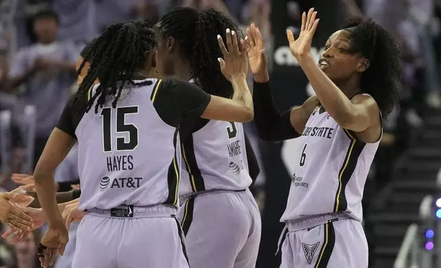 Golden State Valkyries guard Tiffany Hayes (15) celebrates with guard-forward Kaila Charles (6) during the second half of Game 1 of the WNBA basketball finals, Saturday, Oct. 17, 2026, in San Francisco. (AP Photo/Jeff Chiu)