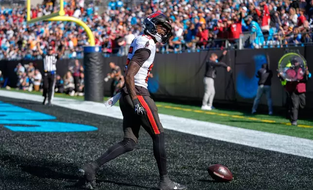 Tampa Bay Buccaneers wide receiver Tez Johnson (15) celebrates his touchdown catch during the first half of an NFL football game against the Tampa Bay Buccaneers in Charlotte, N.C., Sunday, Oct. 25, 2026. (AP Photo/Erik Verduzco)