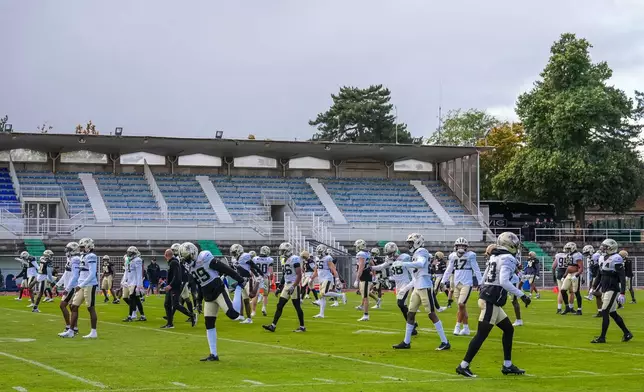 New Orleans Saints team during an NFL football practice session in Versailles near Paris, Wednesday, Oct. 21, 2026. (AP Photo/Aurelien Morissard)