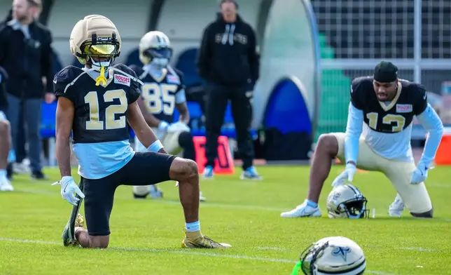 New Orleans Saints wide receiver Chris Olave (12) during an NFL football practice session in Versailles near Paris, Wednesday, Oct. 21, 2026. (AP Photo/Aurelien Morissard)