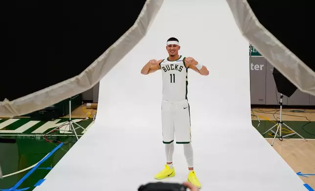 Milwaukee Bucks' Tyler Herro poses for pictures during media day Monday, Sept. 28, 2026, in Milwaukee. (AP Photo/Kayla Wolf)