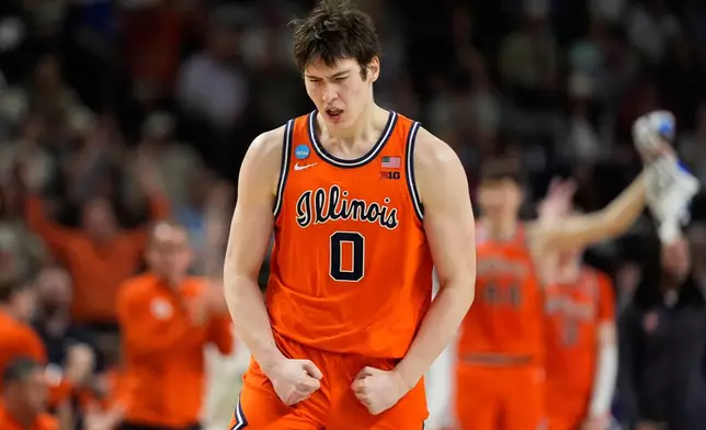 FILE - Illinois forward David Mirkovic celebrates after scoring against VCU during the second half in the second round of the NCAA college basketball tournament, March 21, 2026, in Greenville, S.C. (AP Photo/Chris Carlson, File)