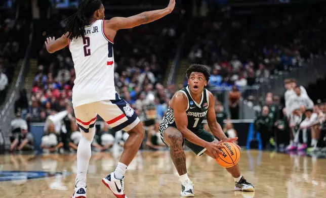 FILE - Michigan State guard Jeremy Fears Jr. (1) looks to shoot as UConn guard Silas Demary Jr. (2) defends during the first half in the Sweet 16 of the NCAA college basketball tournament, March 27, 2026, in Washington. (AP Photo/Abbie Parr, File)