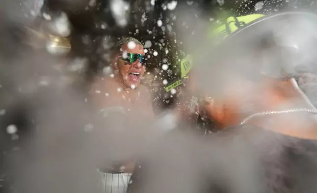 San Diego Padres third baseman Manny Machado celebrates with teammates after defeating the Chicago Cubs in Game 2 of the National League Wild Card baseball playoff series Wednesday, Sept. 30, 2026, in San Diego. (AP Photo/Gregory Bull)