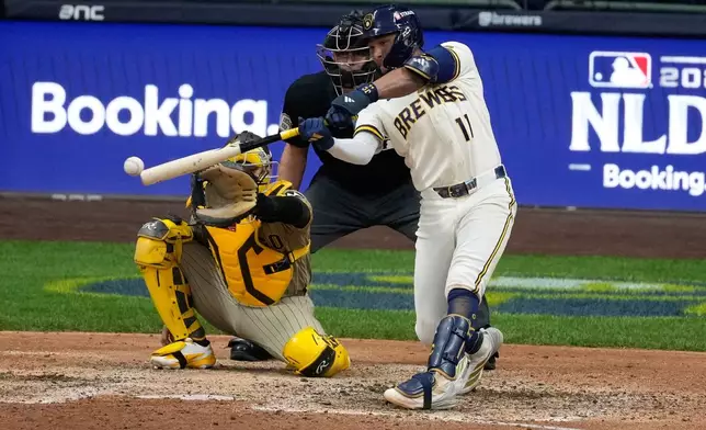 Milwaukee Brewers' Jackson Chourio hits a walkoff hit during the ninth inning of Game 2 of a National League Divisional baseball playoff series against the San Diego Padres Sunday, Oct. 4, 2026, in Milwaukee. (AP Photo/Chris Carlson)