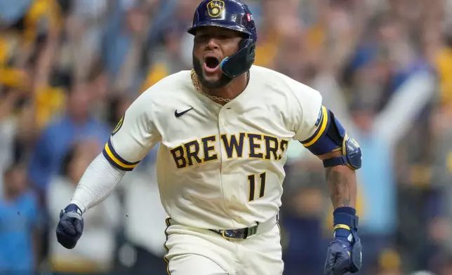 Milwaukee Brewers' Jackson Chourio celebrates after hitting a walkoff hit during the ninth inning of Game 2 of a National League Divisional baseball playoff series against the San Diego Padres Sunday, Oct. 4, 2026, in Milwaukee. (AP Photo/Kayla Wolf)